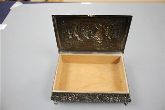 A 20th century continental embossed white metal rectangular bombe shaped cigarette? box, with wood lined interior, 14cm